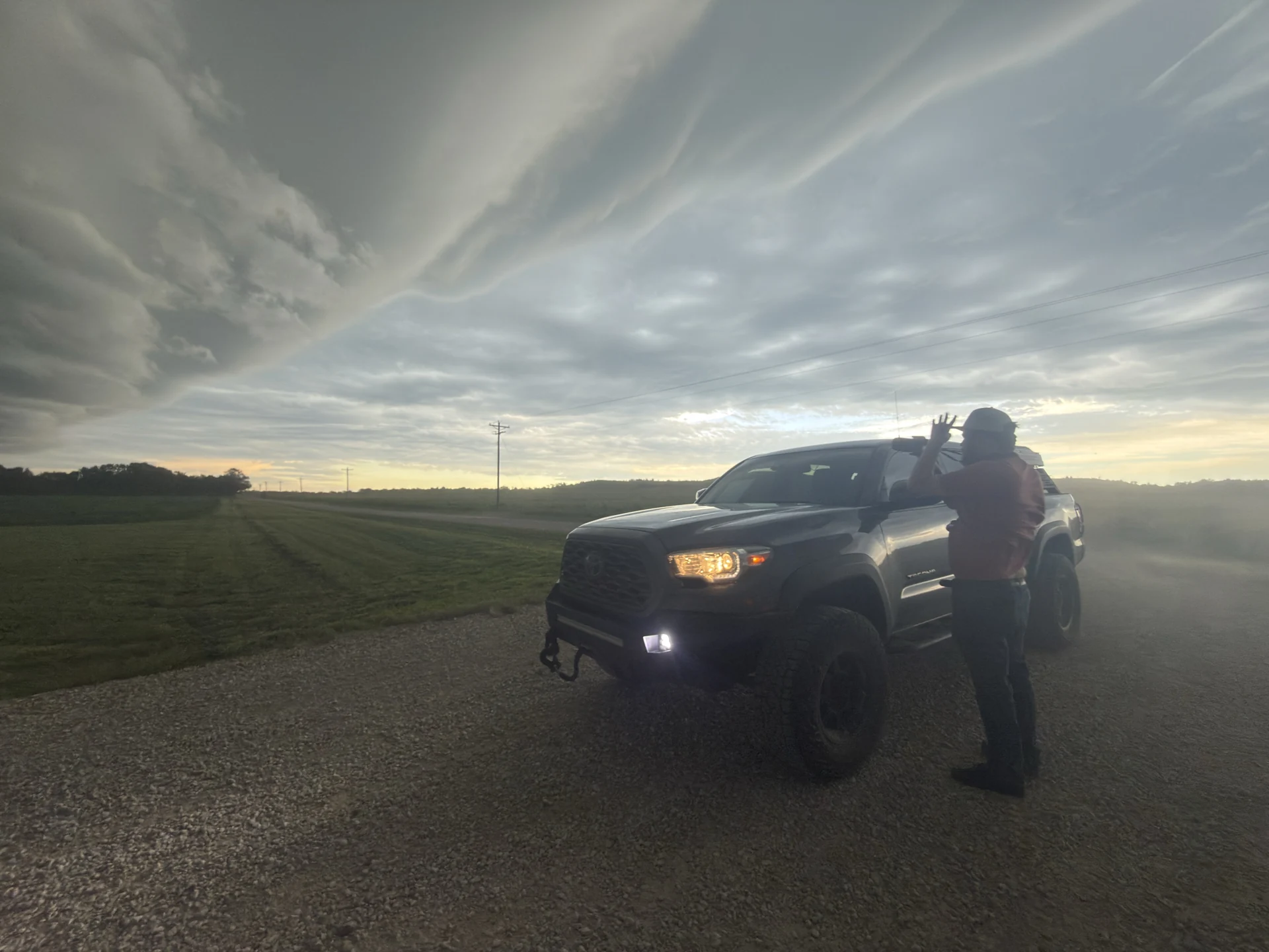 Nick Mounce beside TESSA under a storm sky