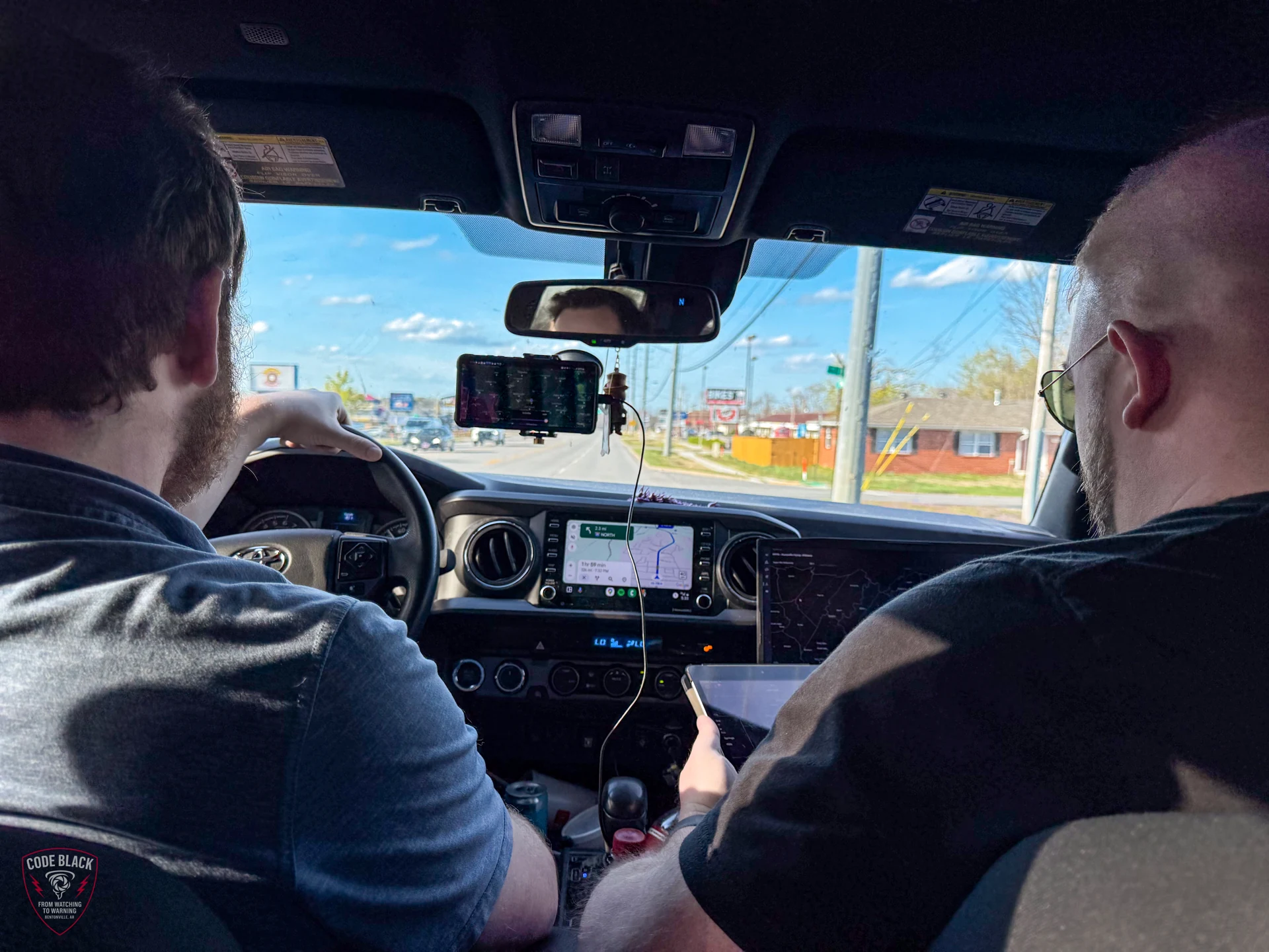 Nick driving and Spencer in the passenger seat of TESSA