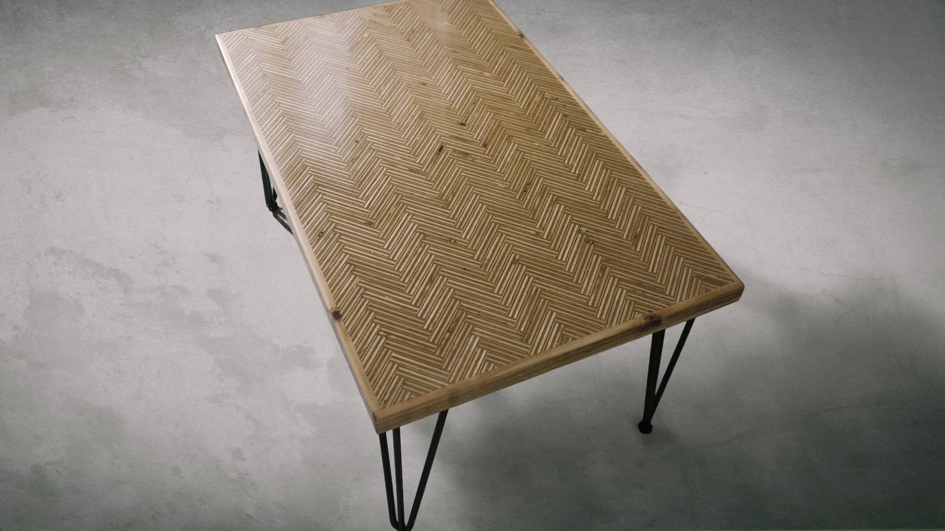 Herringbone-pattern wooden table by Evan Hall